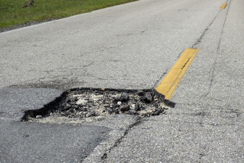 How Weather Conditions Affect Asphalt Cracks And Potholes